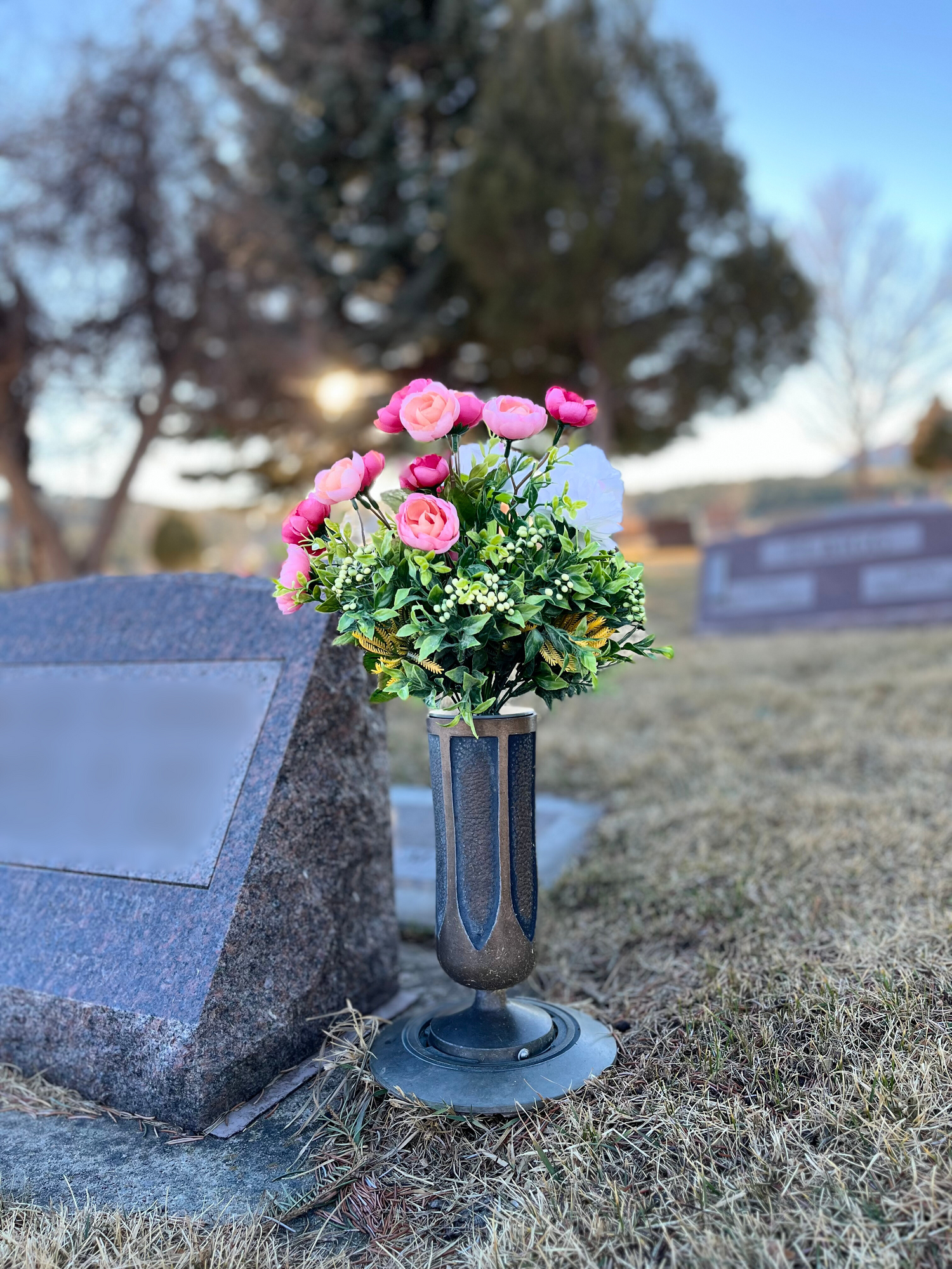 Picture of vase grip securing silk flowers in cemetery vase